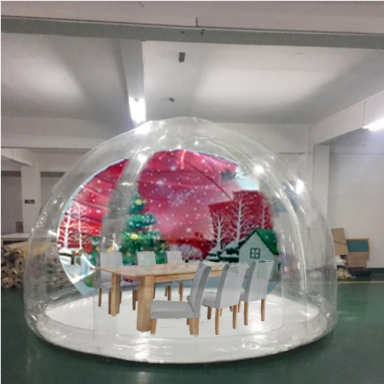 Sealed Snow Globe A transparent dome featuring a decorated dining setup with a Christmas tree and snowy background.