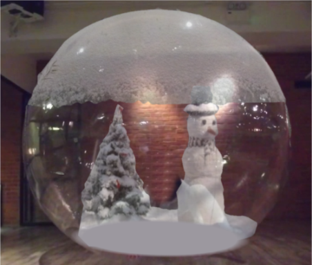 Snow Ball Snow globe featuring a snowman and a snow-covered tree inside.